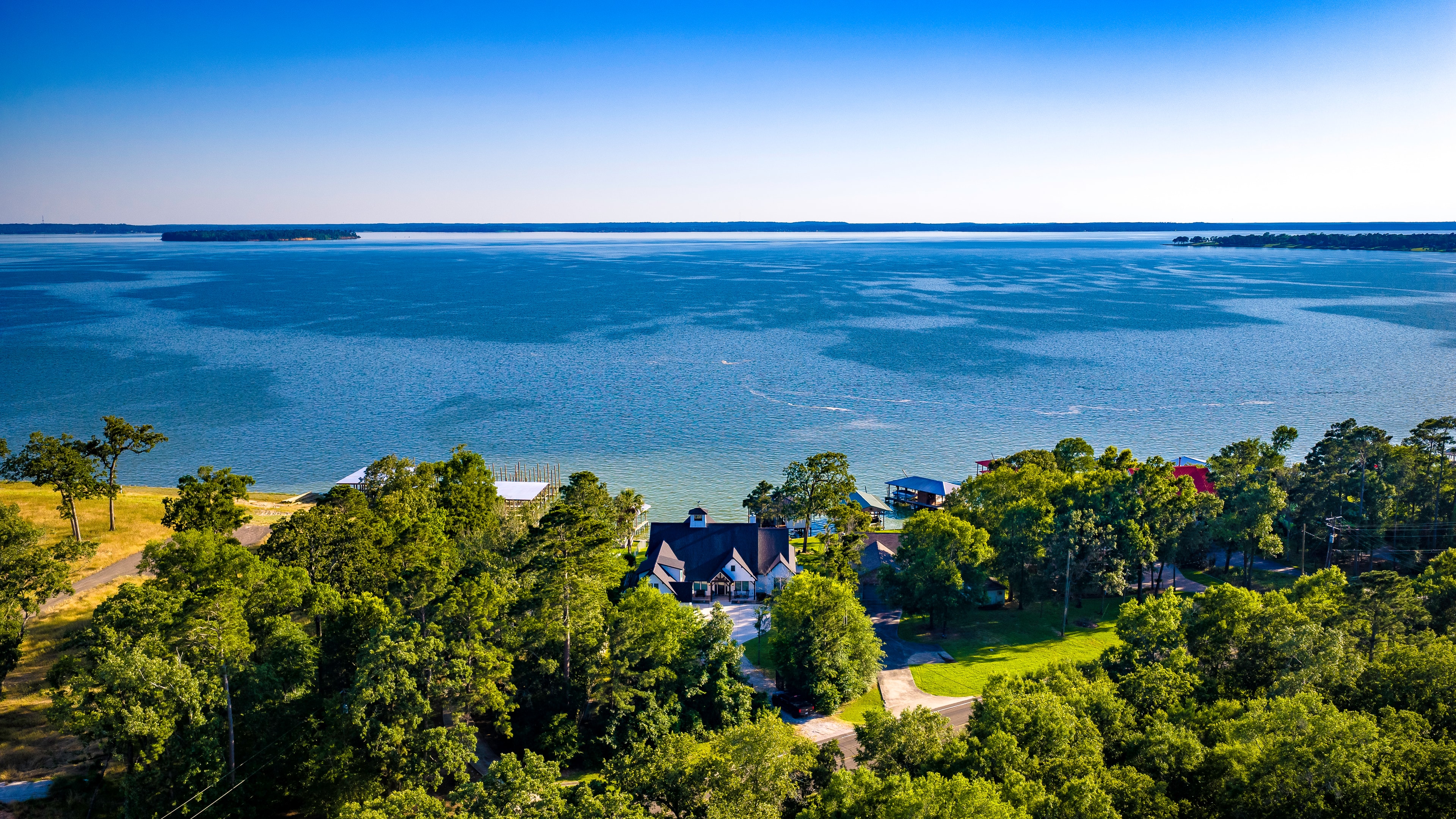 Aerial drone view of lake house property