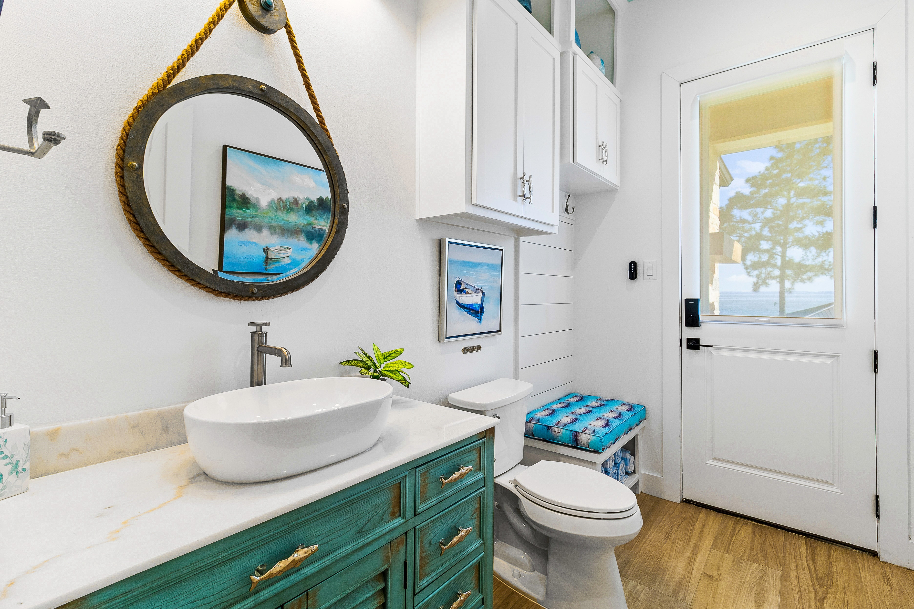Coastal bathroom with nautical mirror decor