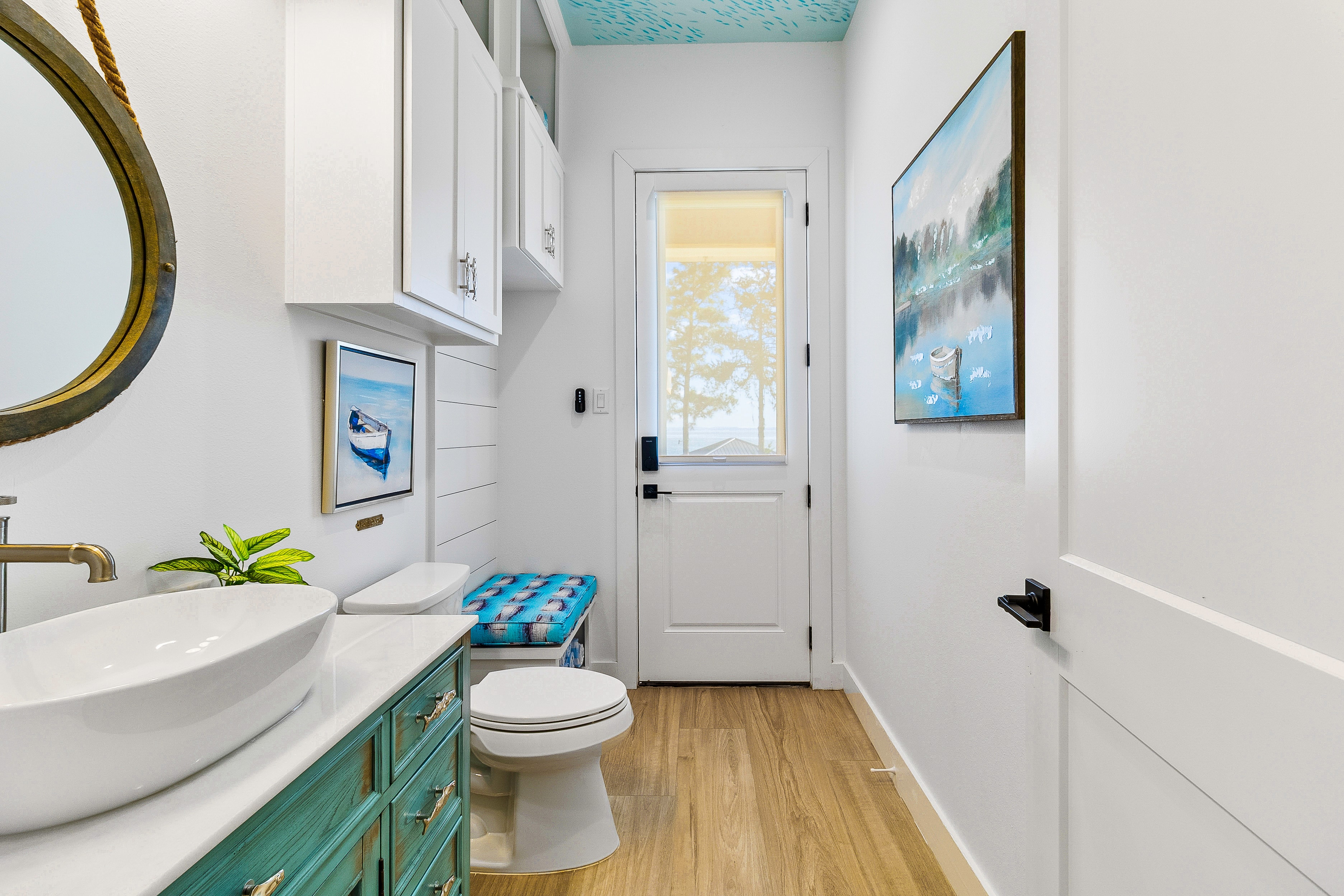 Modern bathroom with coastal decor and natural light