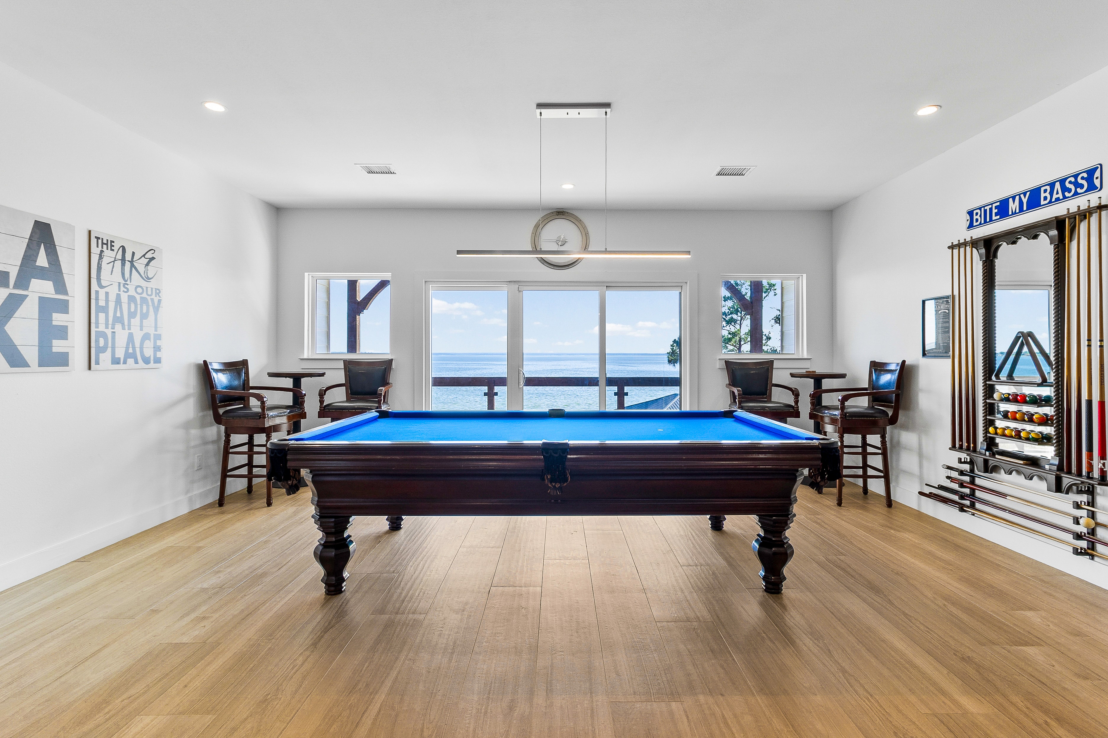 Game room with pool table and ocean view