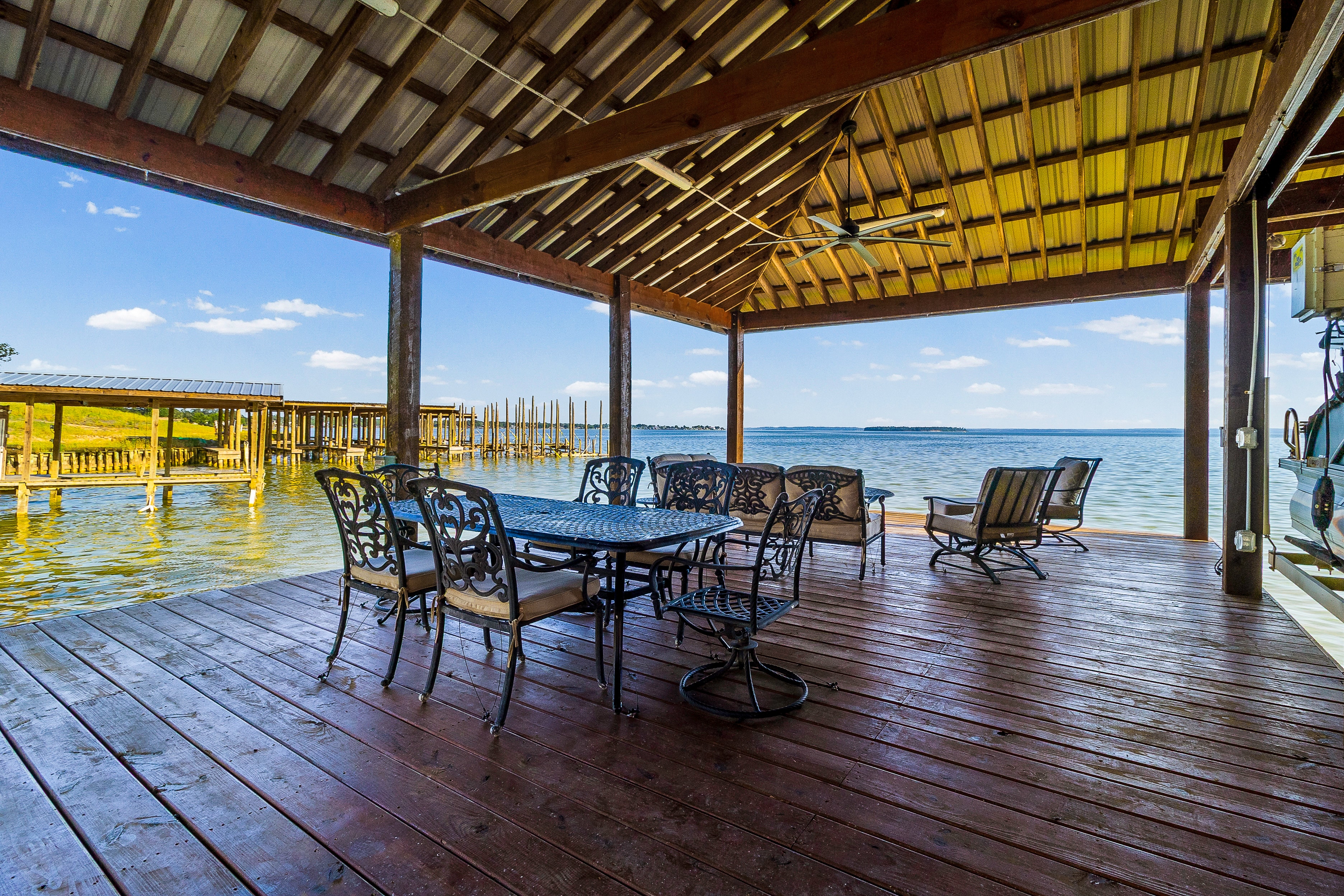 Waterfront deck with dining furniture overlooking the lake