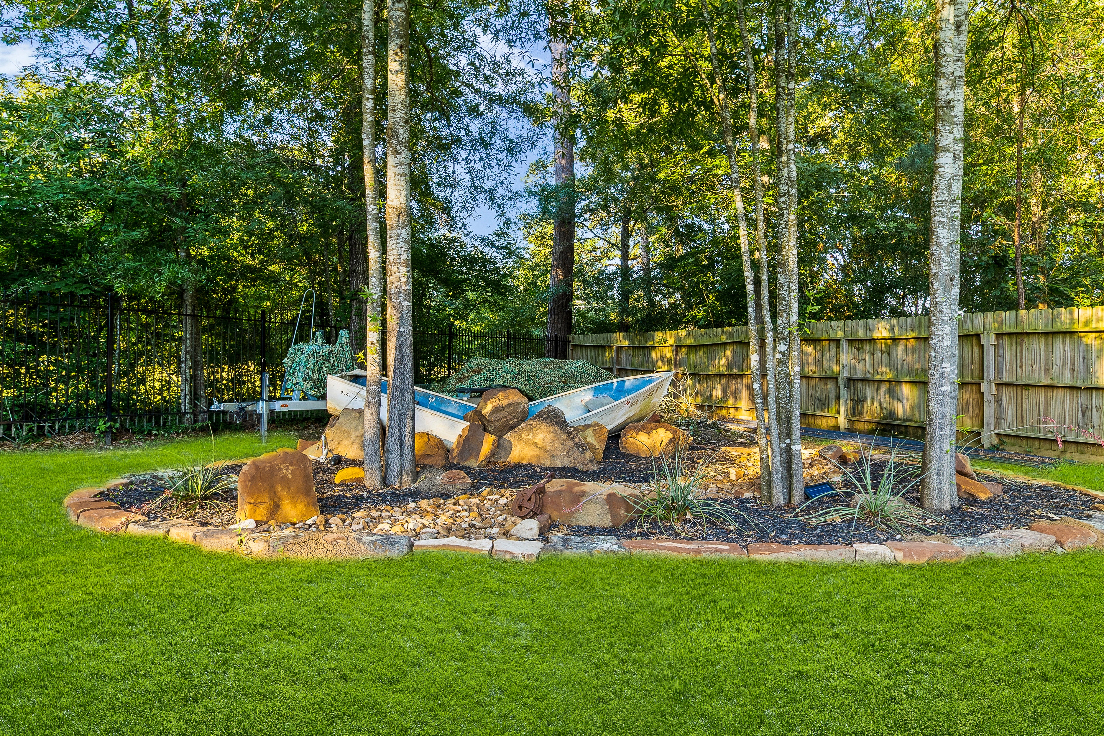 Decorative boats in backyard garden landscape
