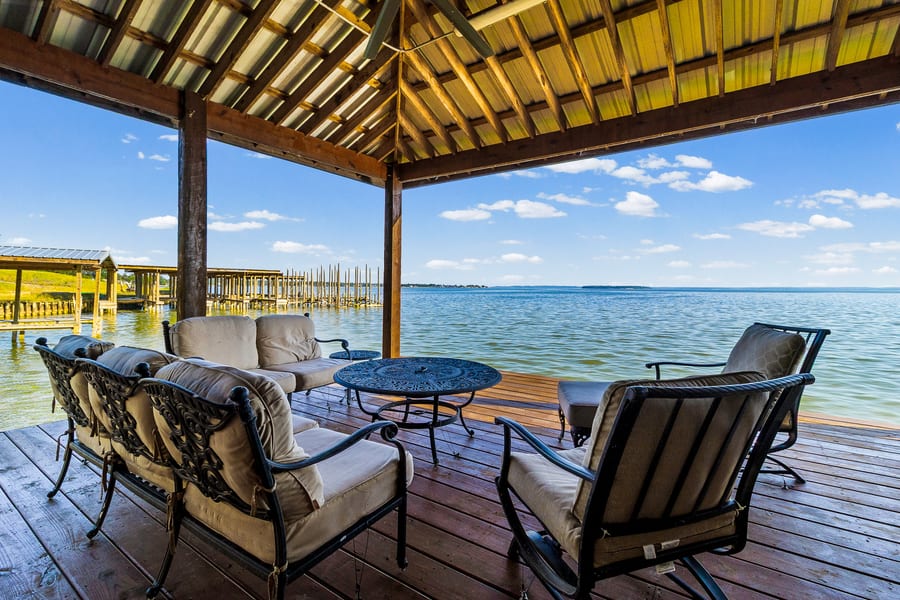 Waterfront deck with lounge seating overlooking the bay